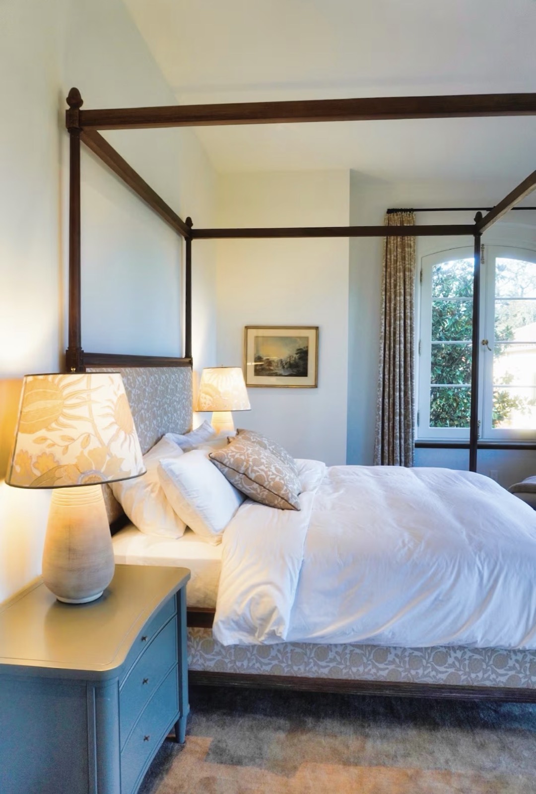 Primary bedroom with four-poster canopy bed